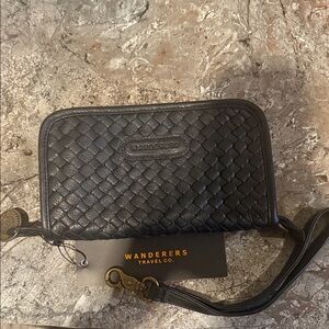 NWT Wanderers Black Woven Wristlet 9in x 5 in. Comes with coin purse